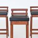 Erik Buck set of three bar stools in teak and leather Dyrlund Denmark 1960