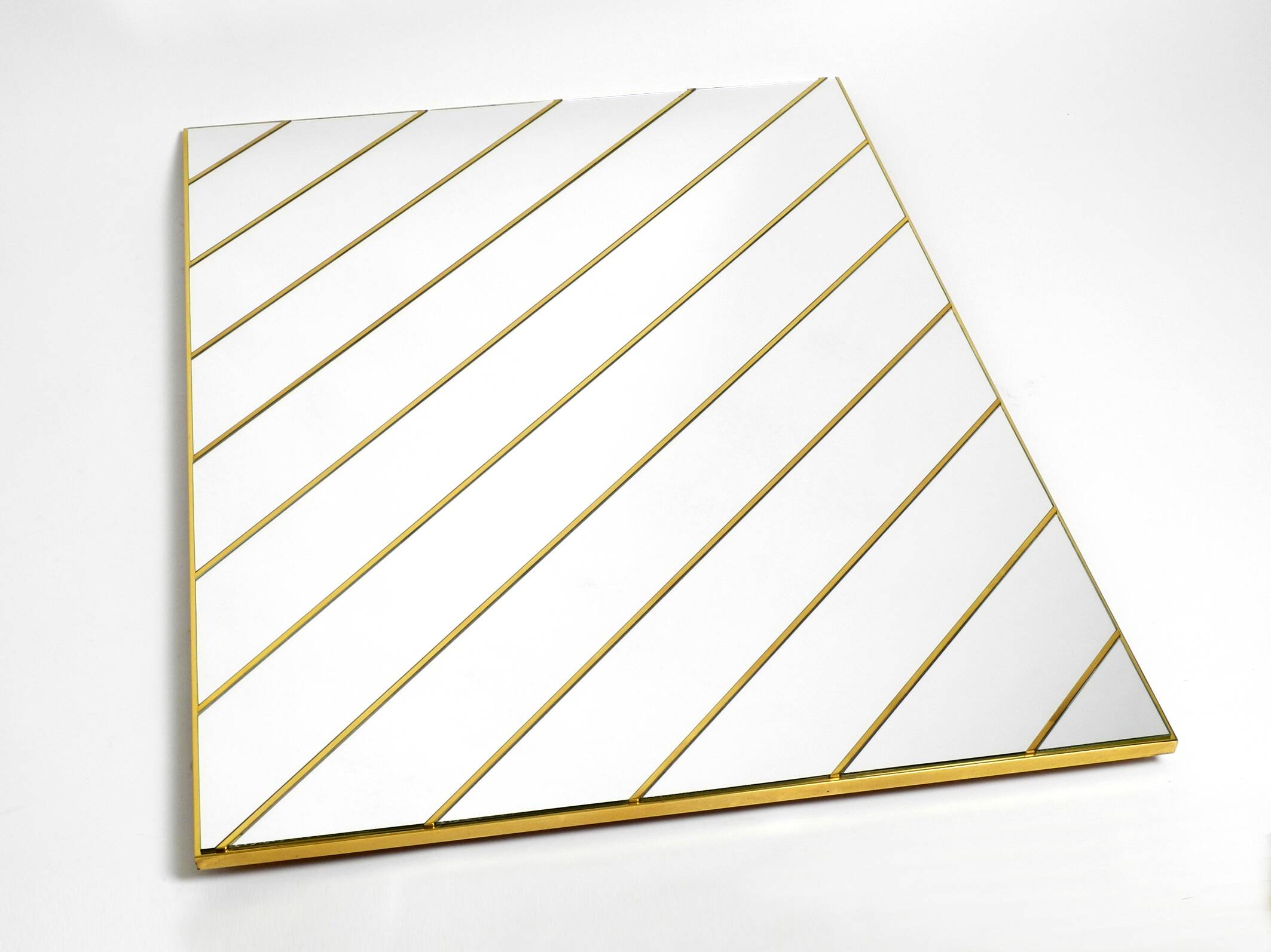 Large, exceptional 1970s brass wall mirror with diagonal mirror strips