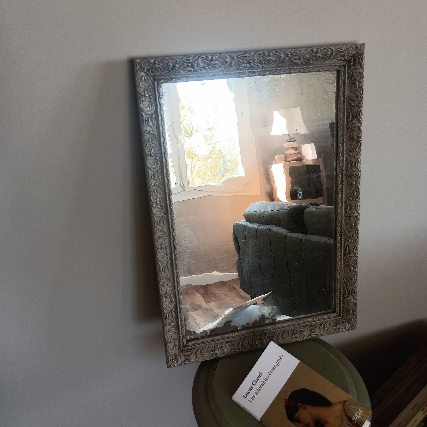 Antique mirror in carved, painted and patinated wood