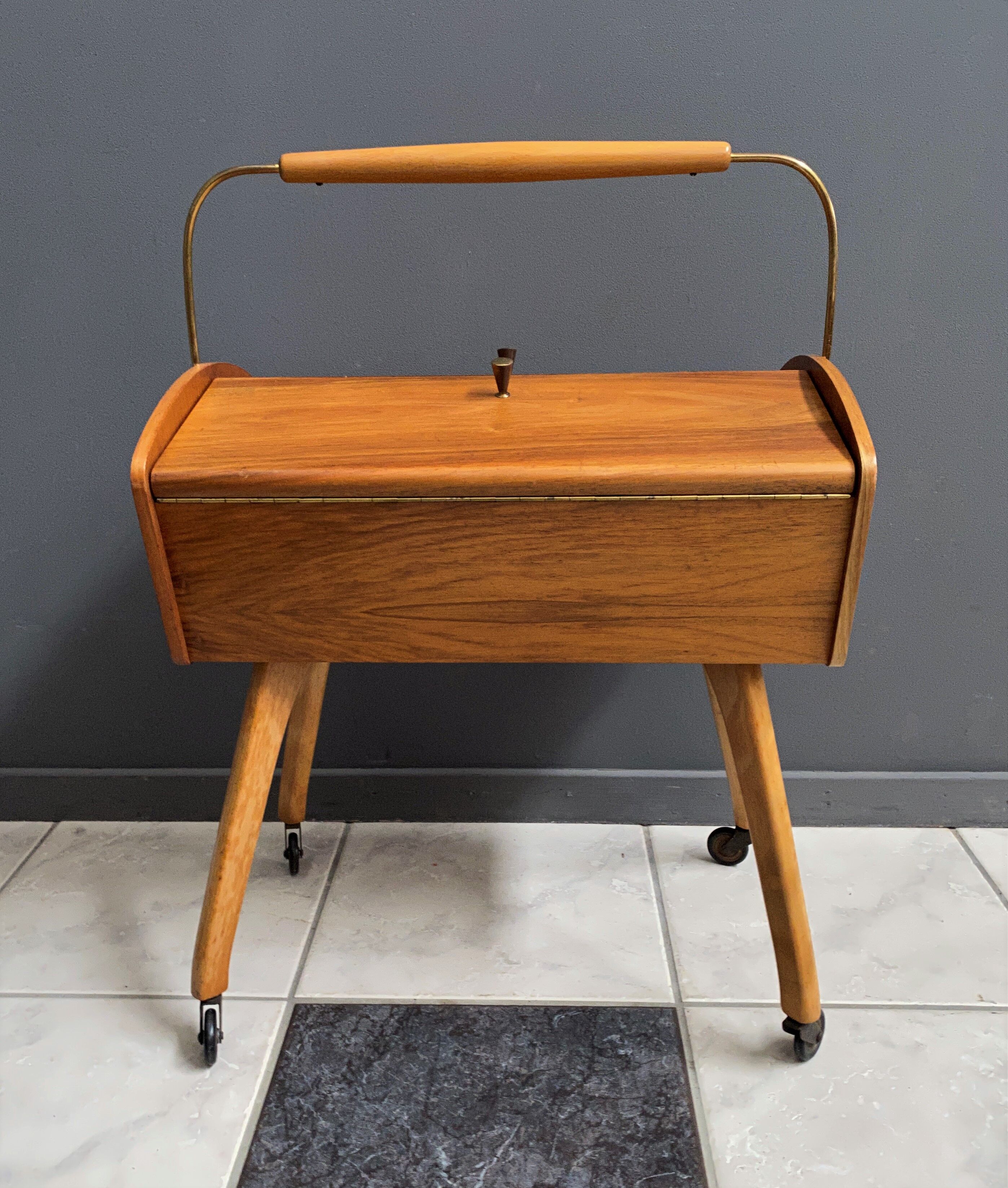 Sewing box on legs and wheels