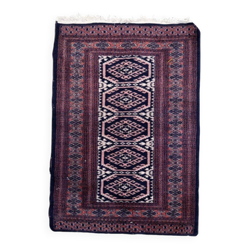 Handmade vintage 1960s Uzbek Bukhara rug – small wool tribal carpet (65cm x 95cm)