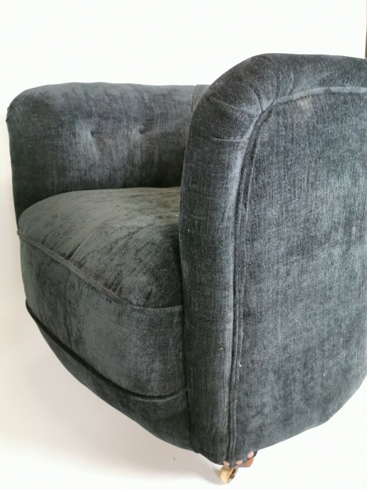 19th century black upholstered victorian tub chair on brass casters