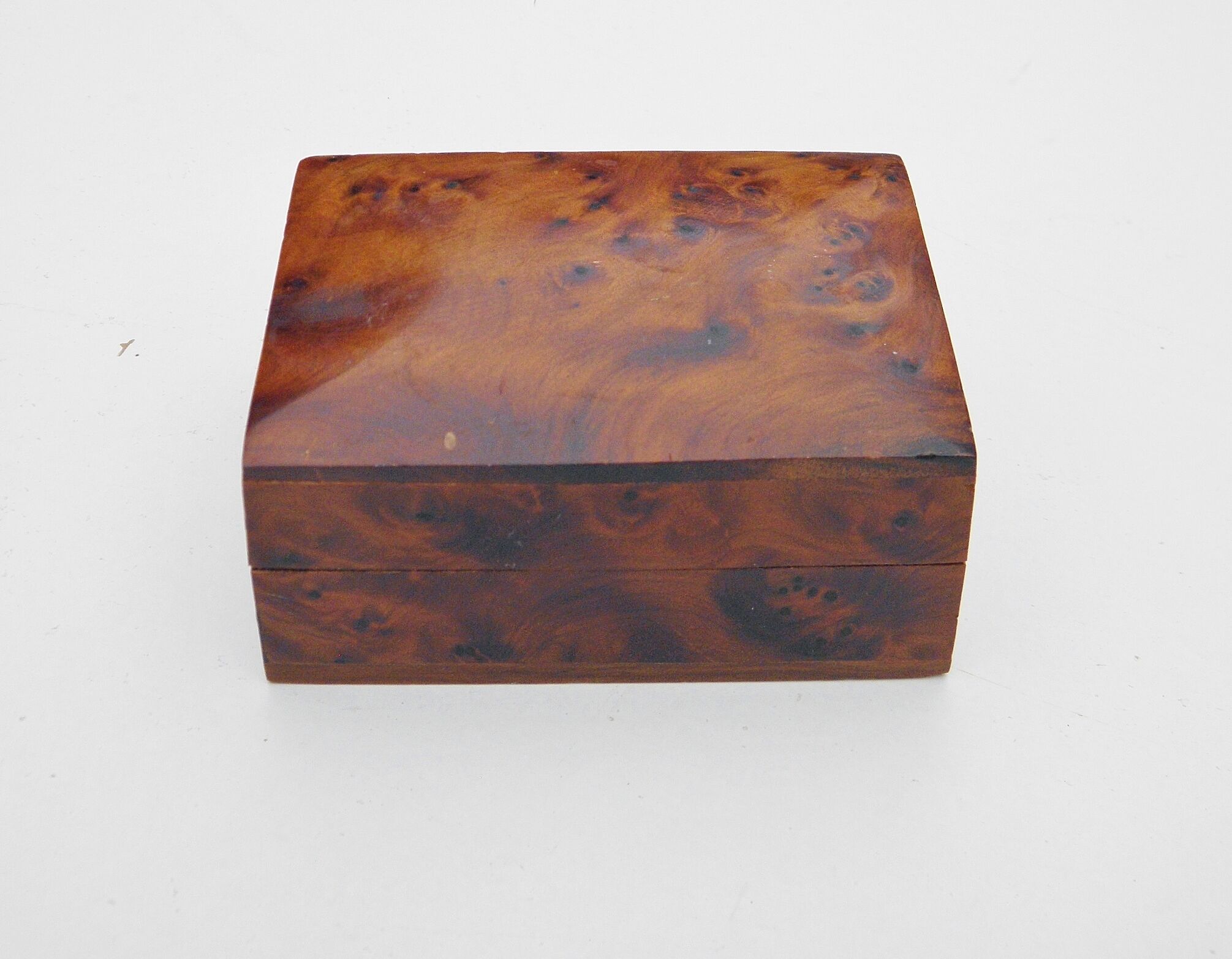 Three boxes in thuya magnifying glass