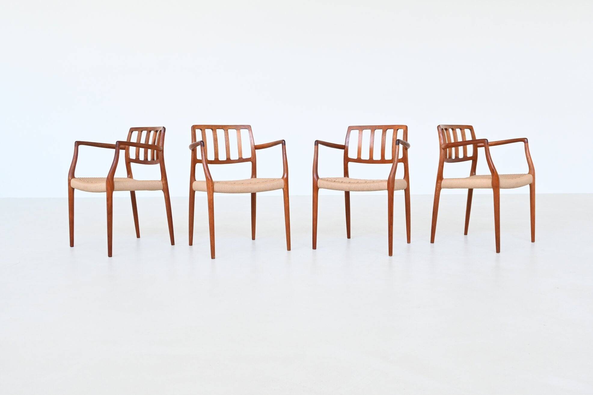 Niels Otto Moller model 66 armchairs teak and paper cord Denmark 1974