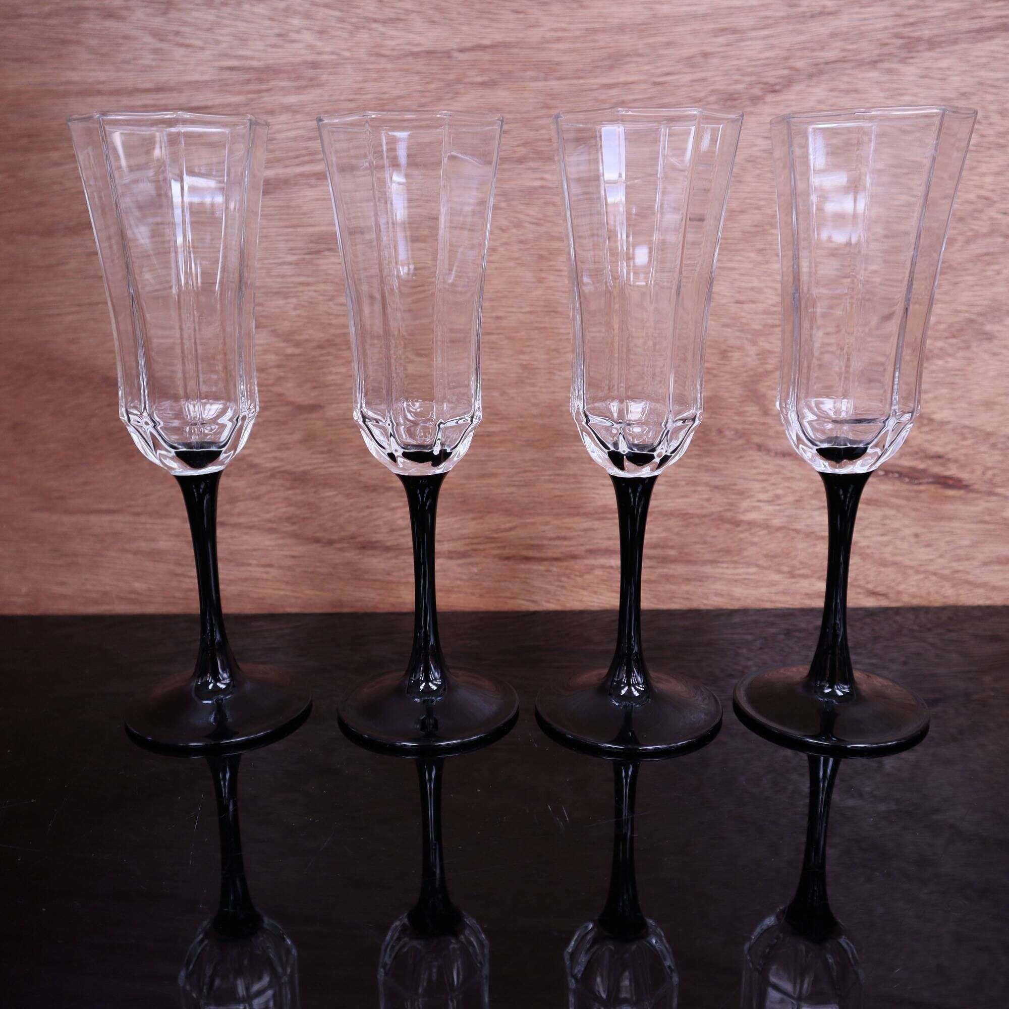 4 octagonal black base Champagne flutes Octime