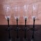 4 octagonal black base Champagne flutes Octime
