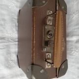 Old metal cardboard suitcase