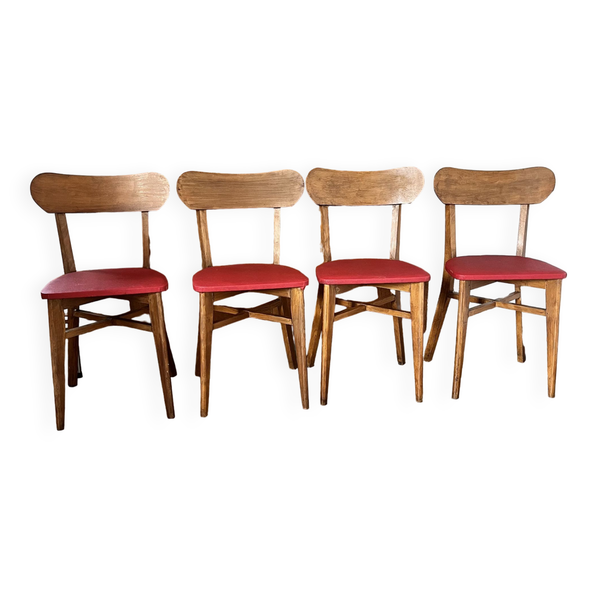 Set of 4 wooden chairs with red vinyl.