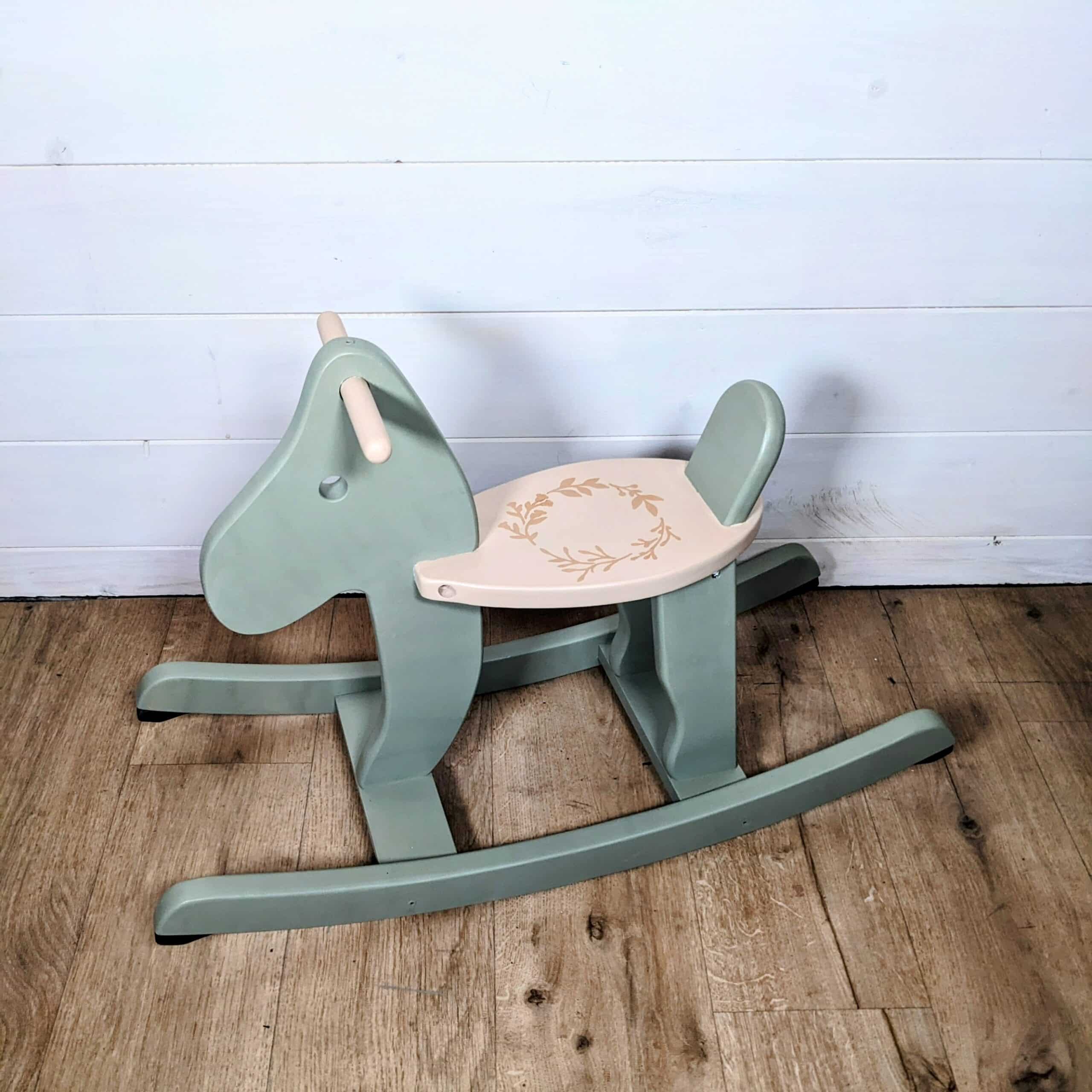Green and beige wooden rocking horse