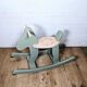 Green and beige wooden rocking horse