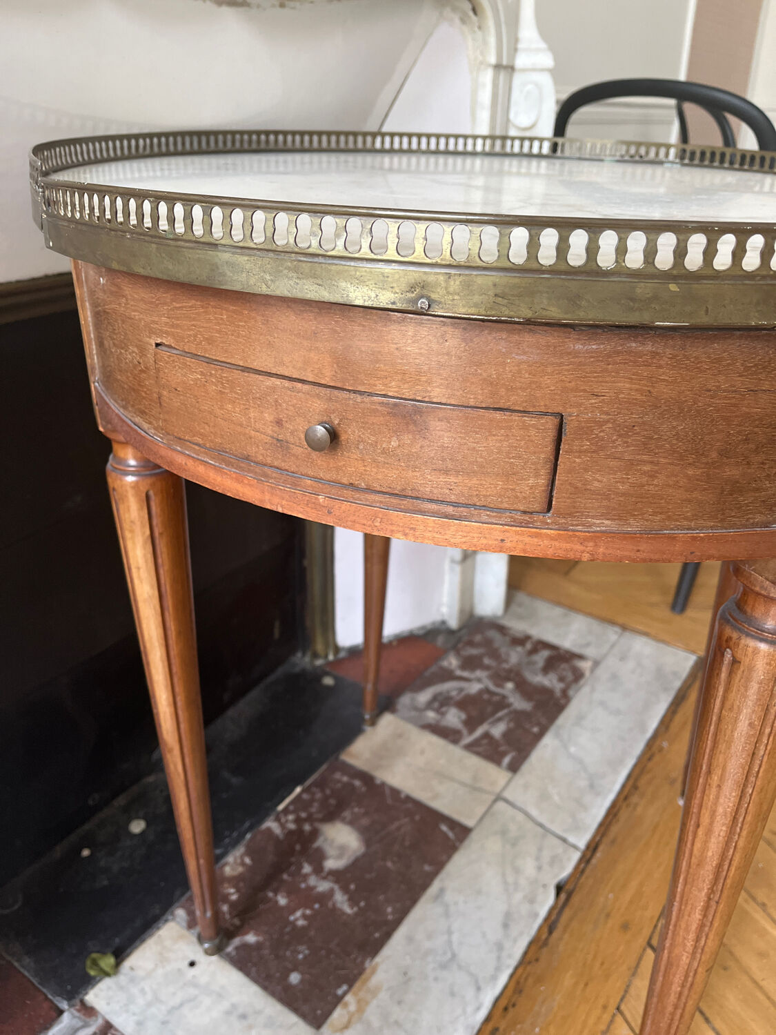 Bouillotte table with marble top in Louis XVI style.
