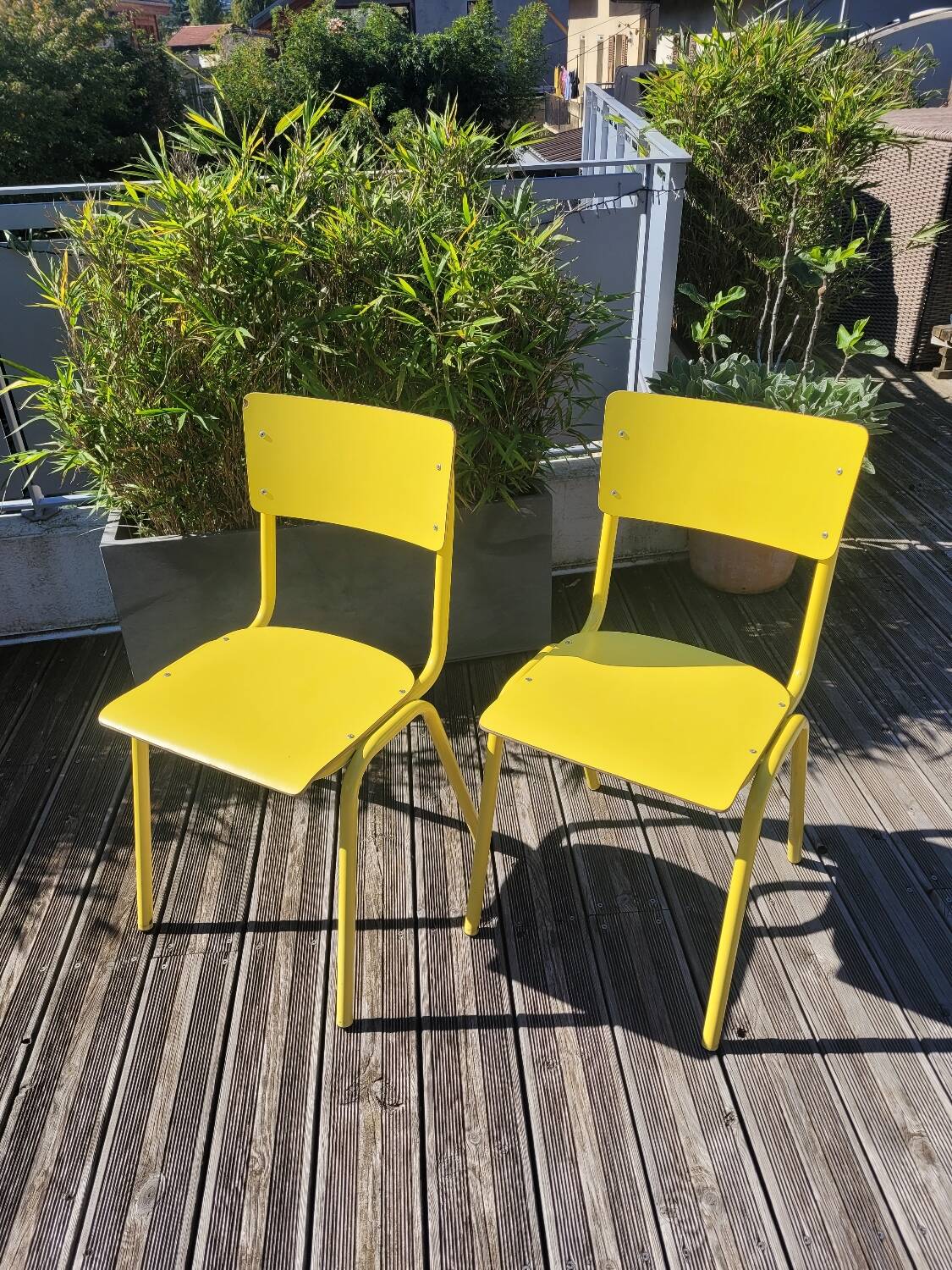 Pair of yellow plywood chairs