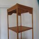 Storage column, wooden bookshelf and woven rattan.