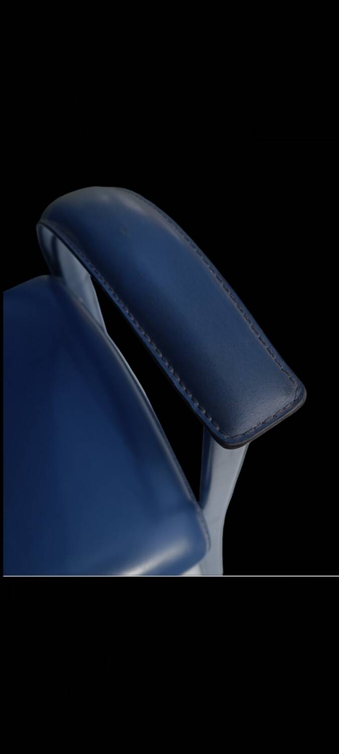 Armchairs covered in vintage blue leather