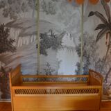 Child's bed in rattan of the years 50