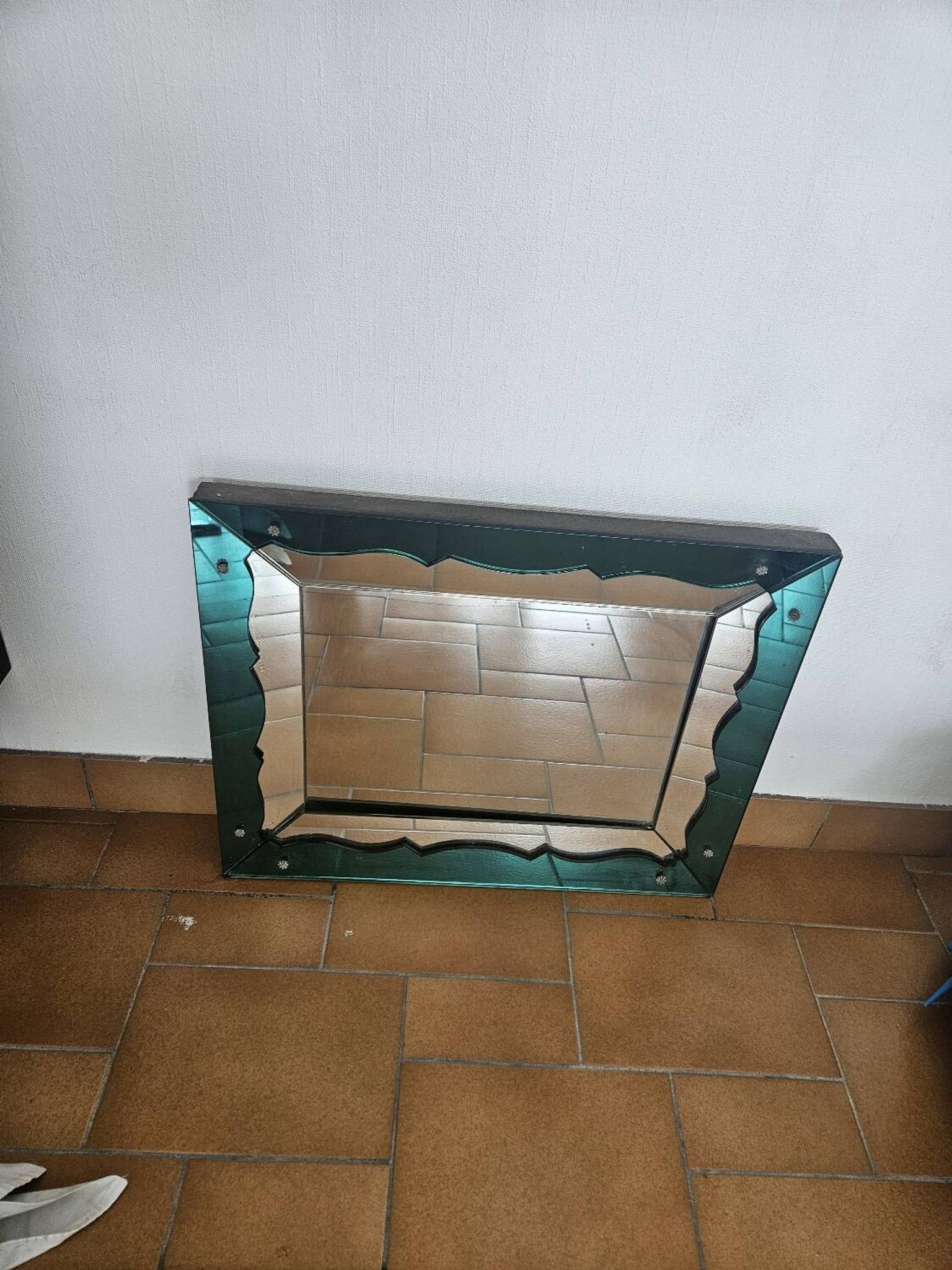 Turquoise green mirror in Hollywood Regency style