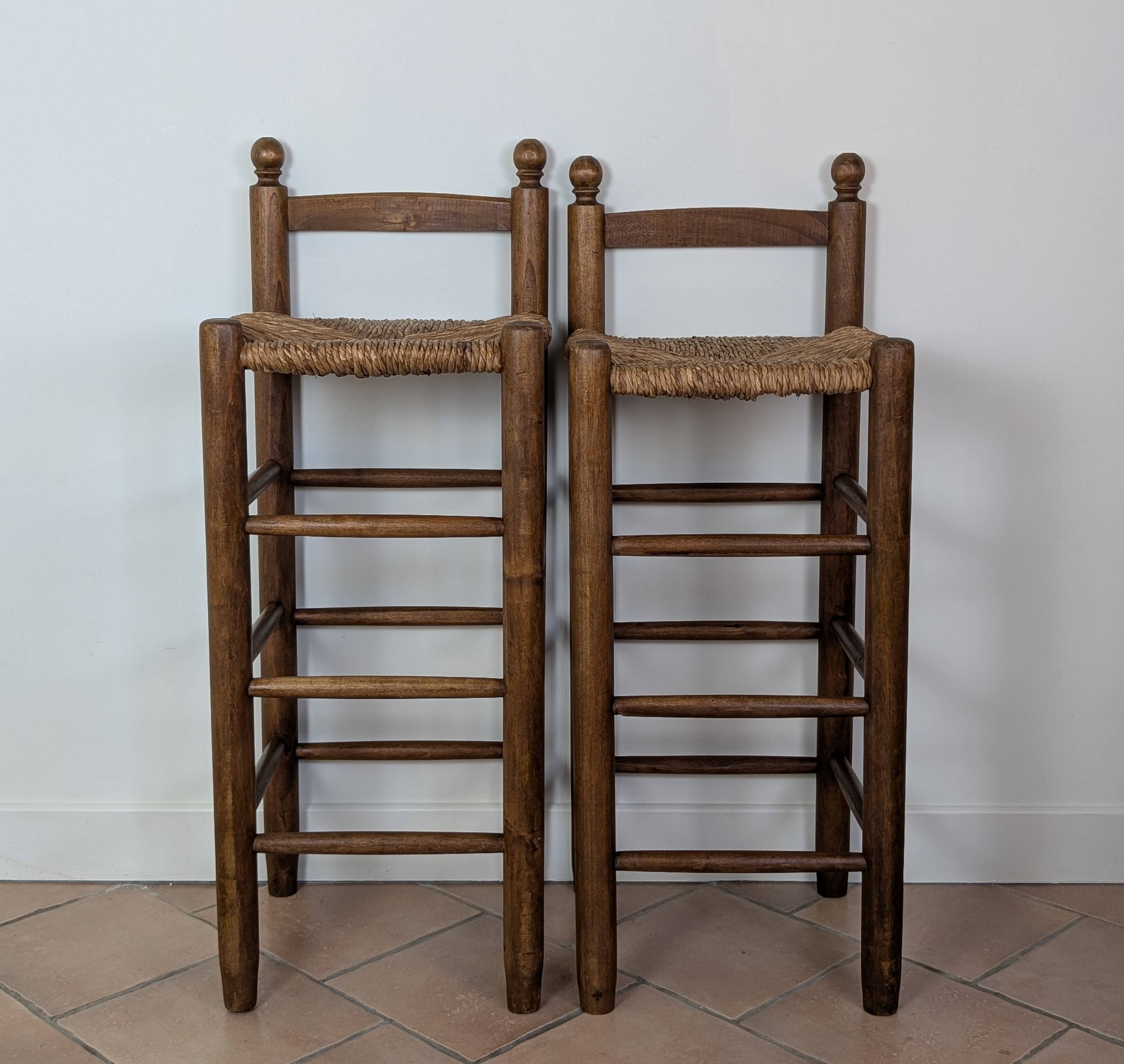 High wooden and straw stools