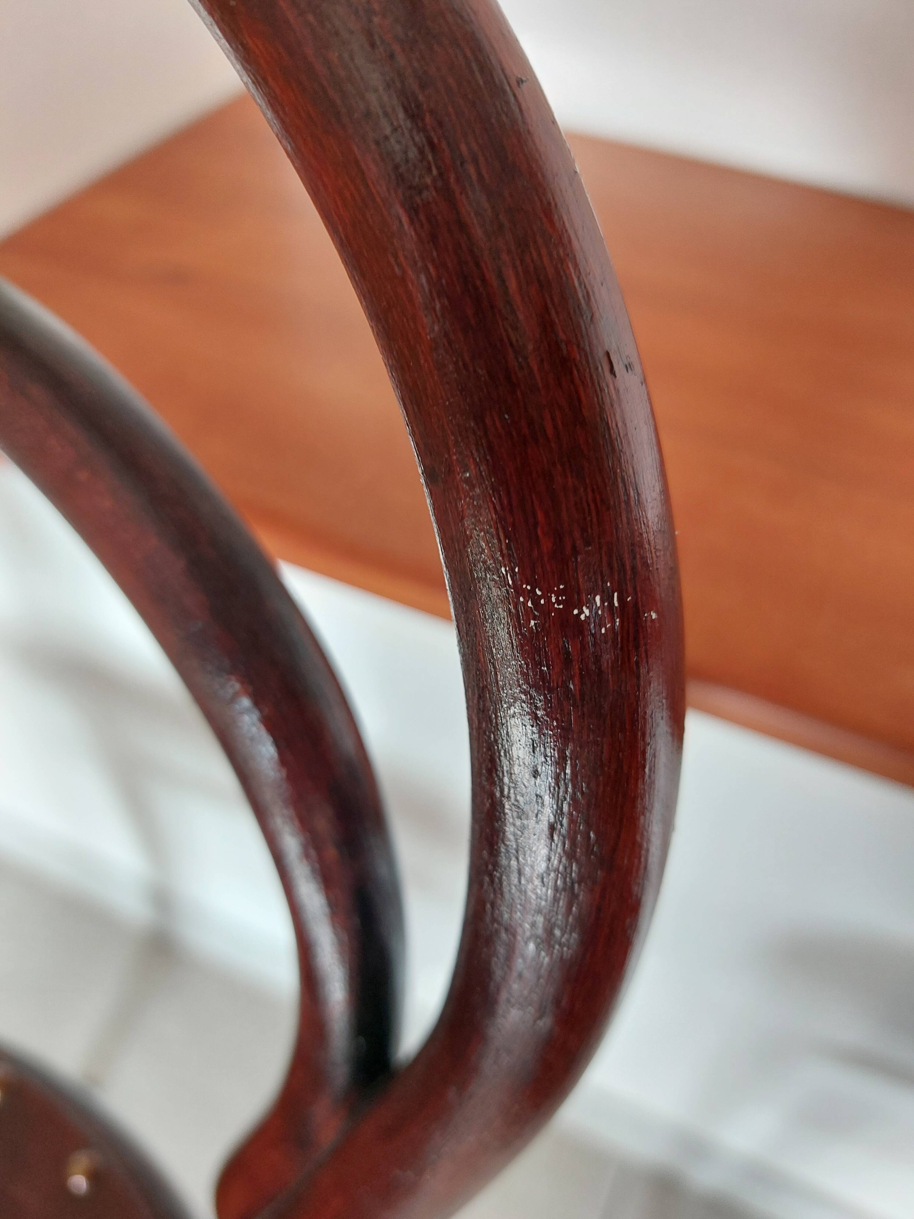 pair of round bistro chairs with a pattern on the seat, vintage