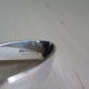 Angora tripod and silver metal spoon