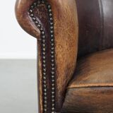 Sheep leather club chair finished with decorative nails