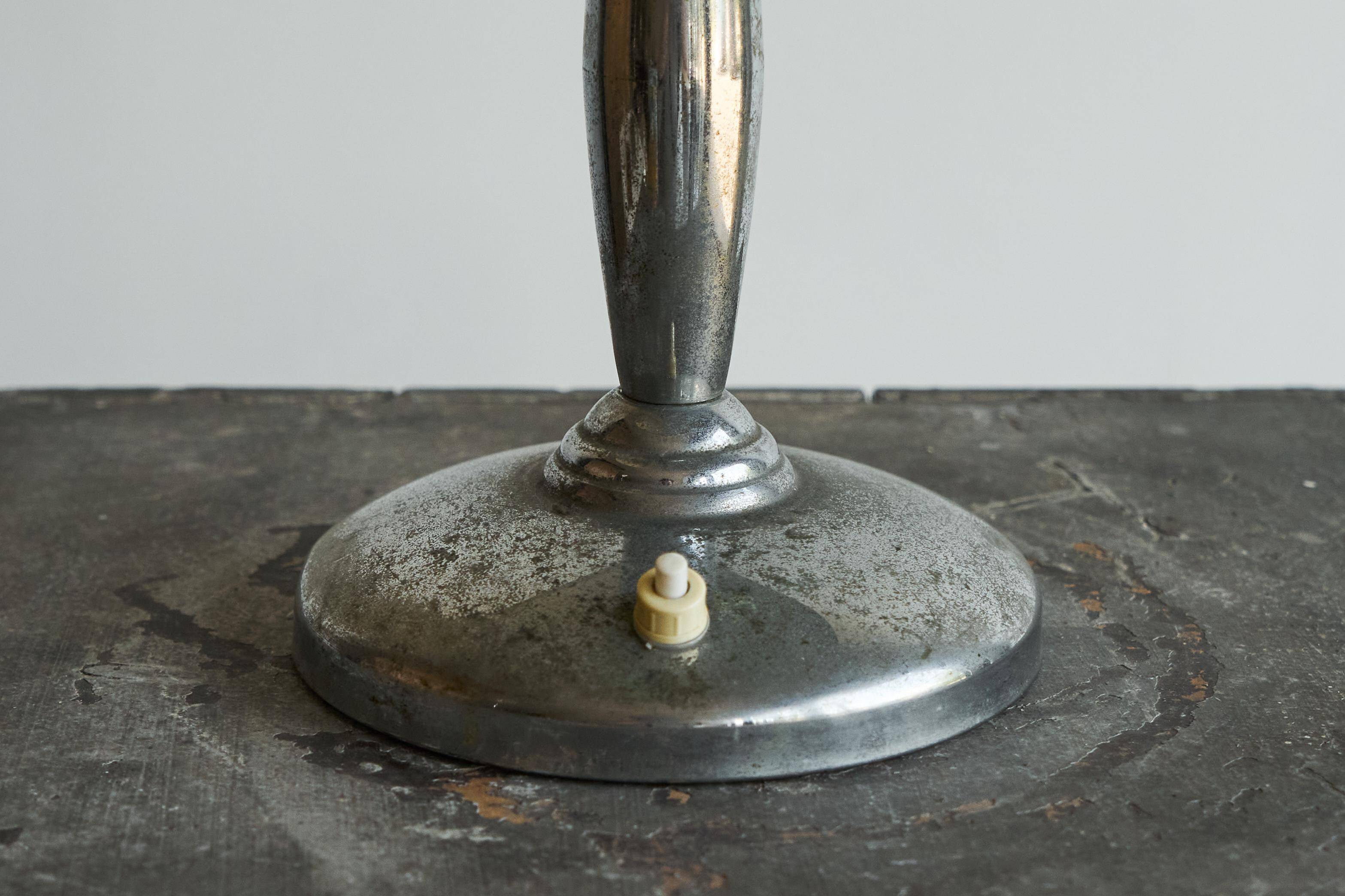 Patinated brass and chrome table lamp from the 1950s.