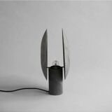 Table lamp in aluminum, oxidized, contemporary work.