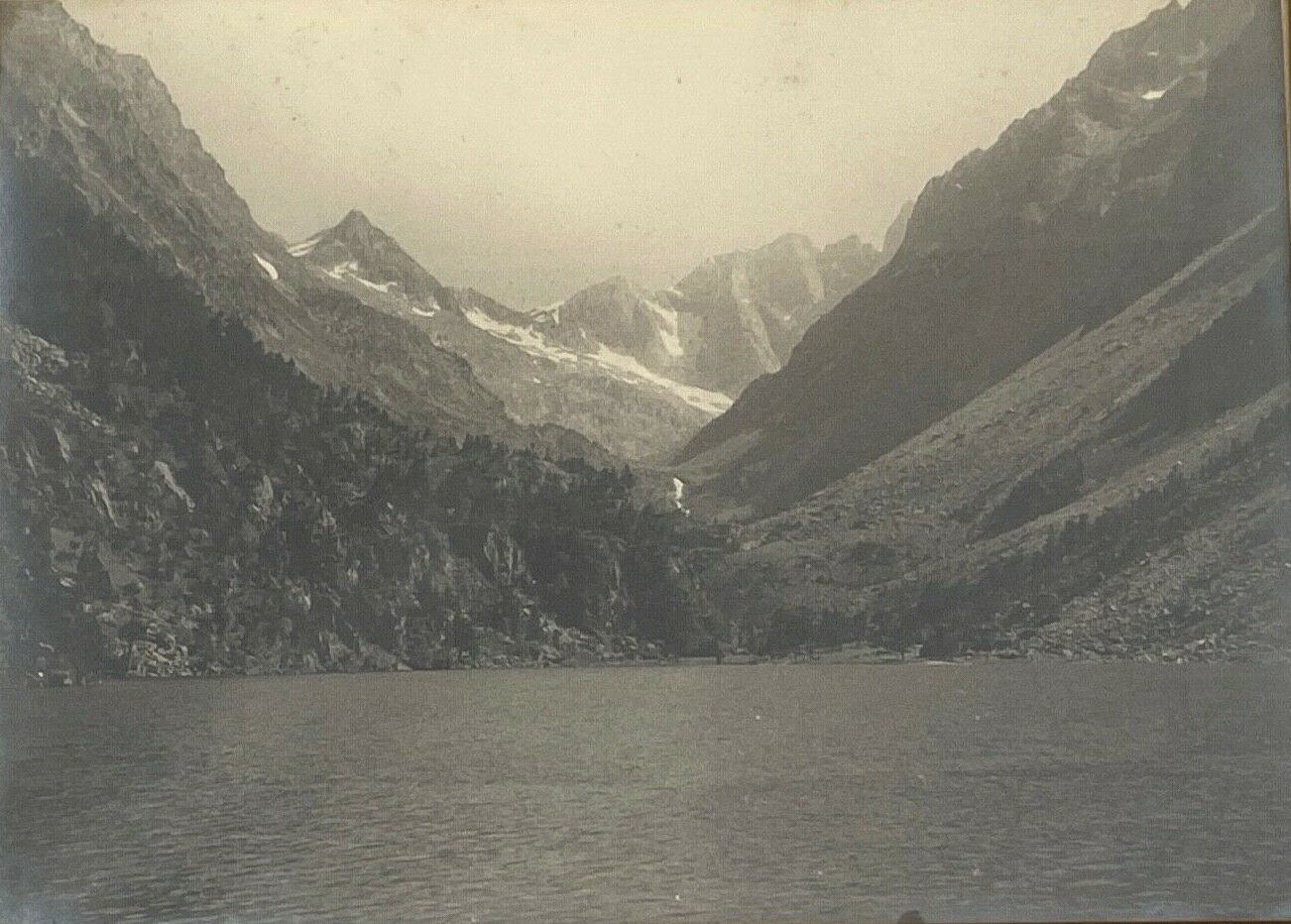 Photo in black and white mountain lake in golden frame