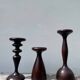 Trio of large turned wooden candlesticks