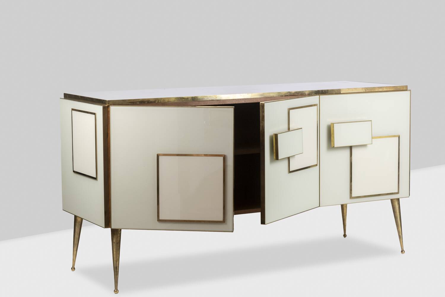 Geometric sideboard in glass and gilded brass. Contemporary Italian work.