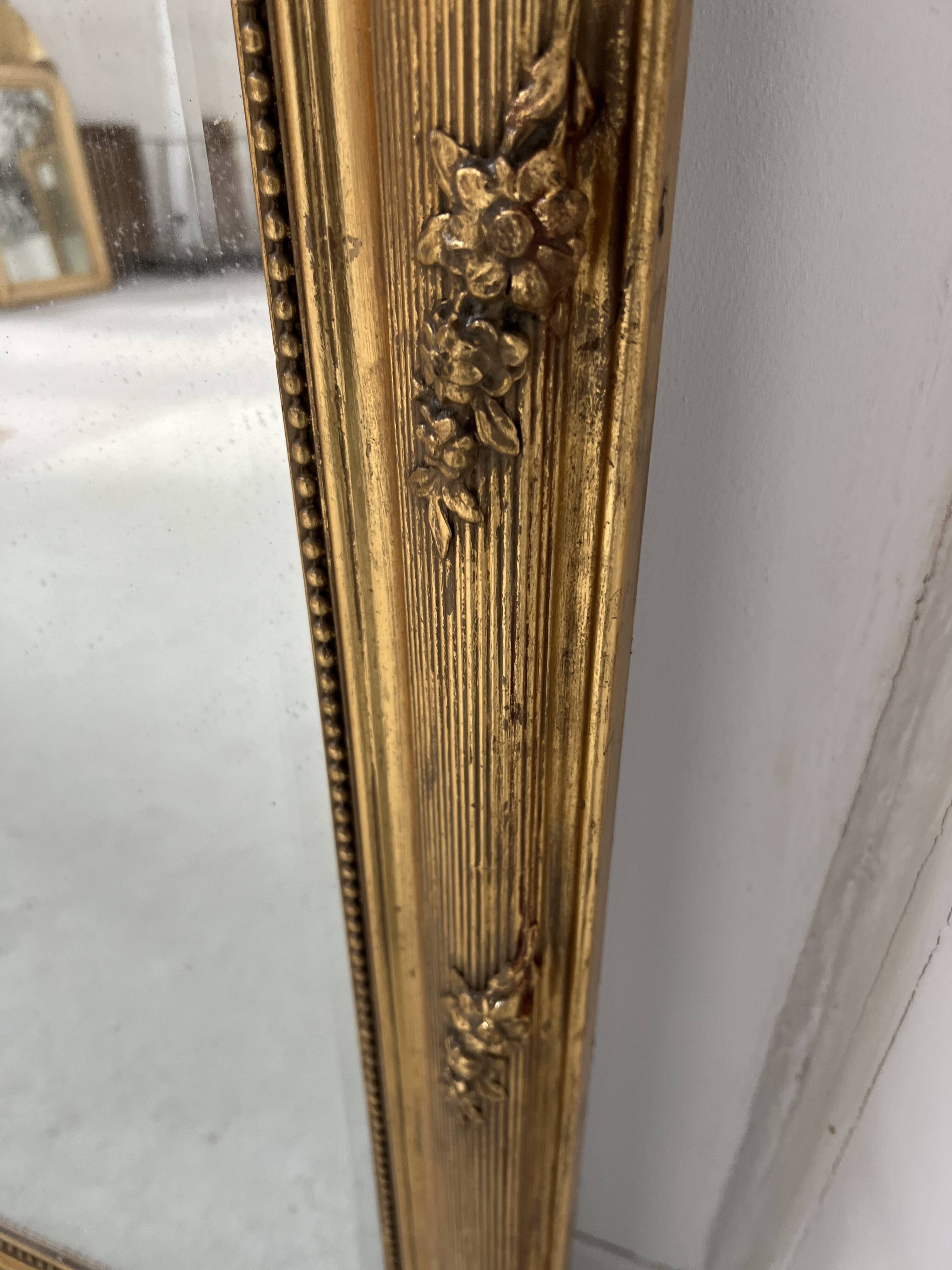 Louis XVI style mirror in wood and gilded stucco, 19th century