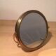 Vintage magnifiing gold round barber mirror