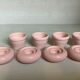 Four double pink candlesticks