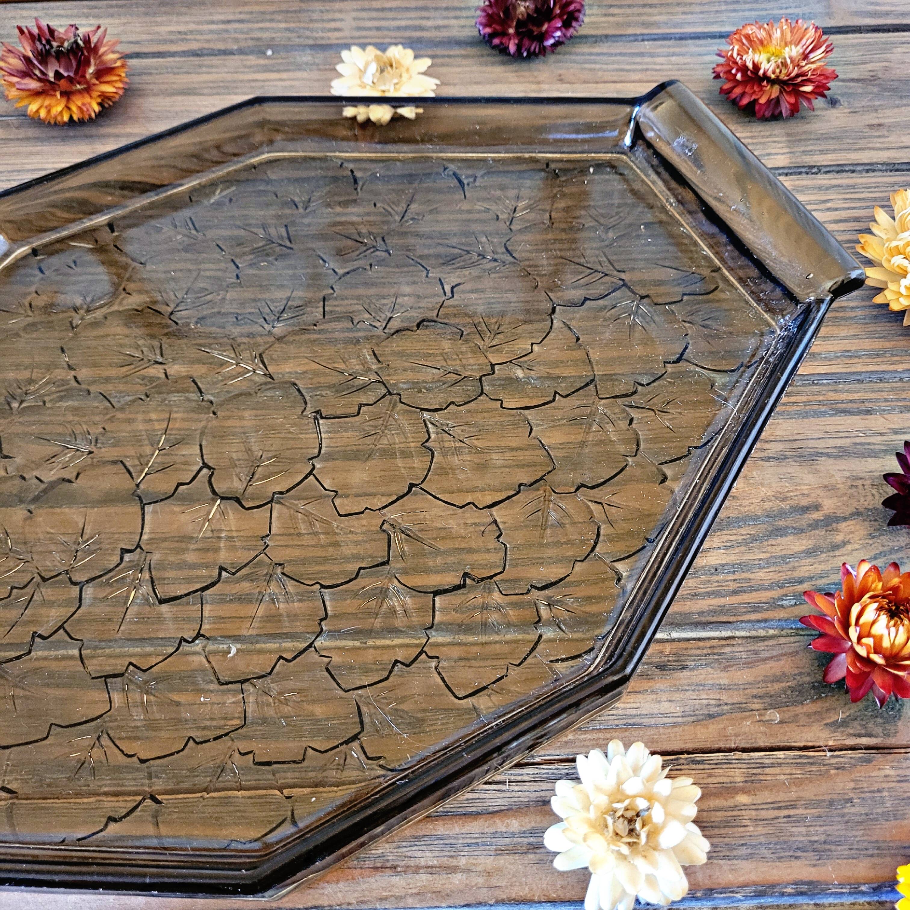 Art deco style black glass tray decorated with leaves