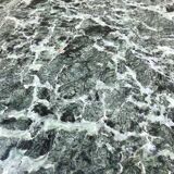Low marble and black metal table