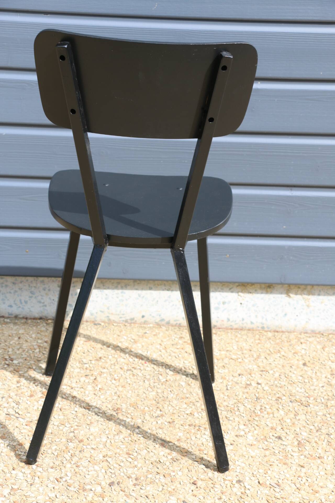 4 black metal and wood chairs