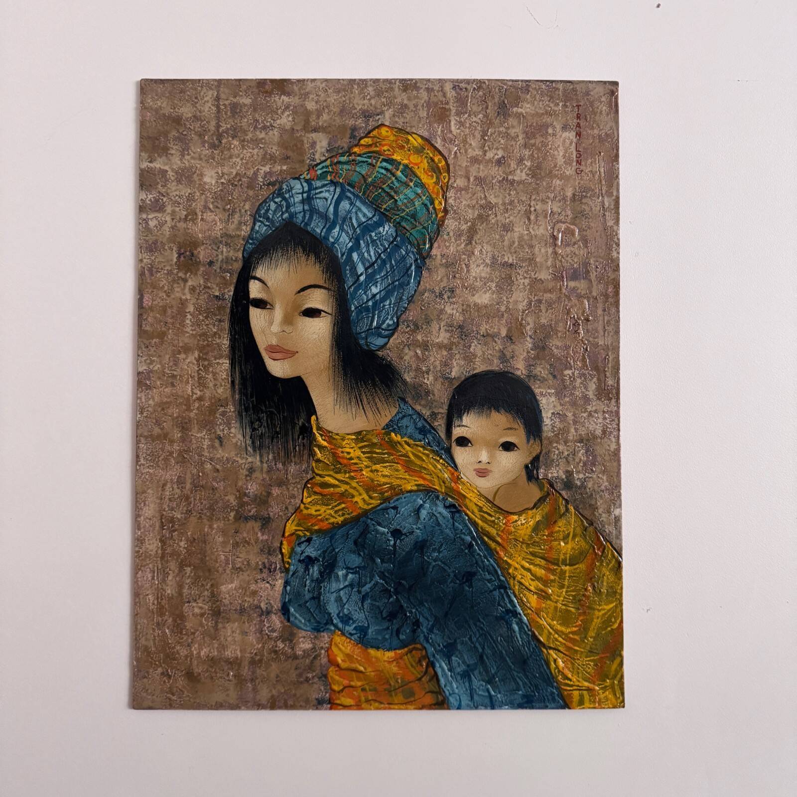 Acrylic on cardboard by Tran Long a mother carrying her child