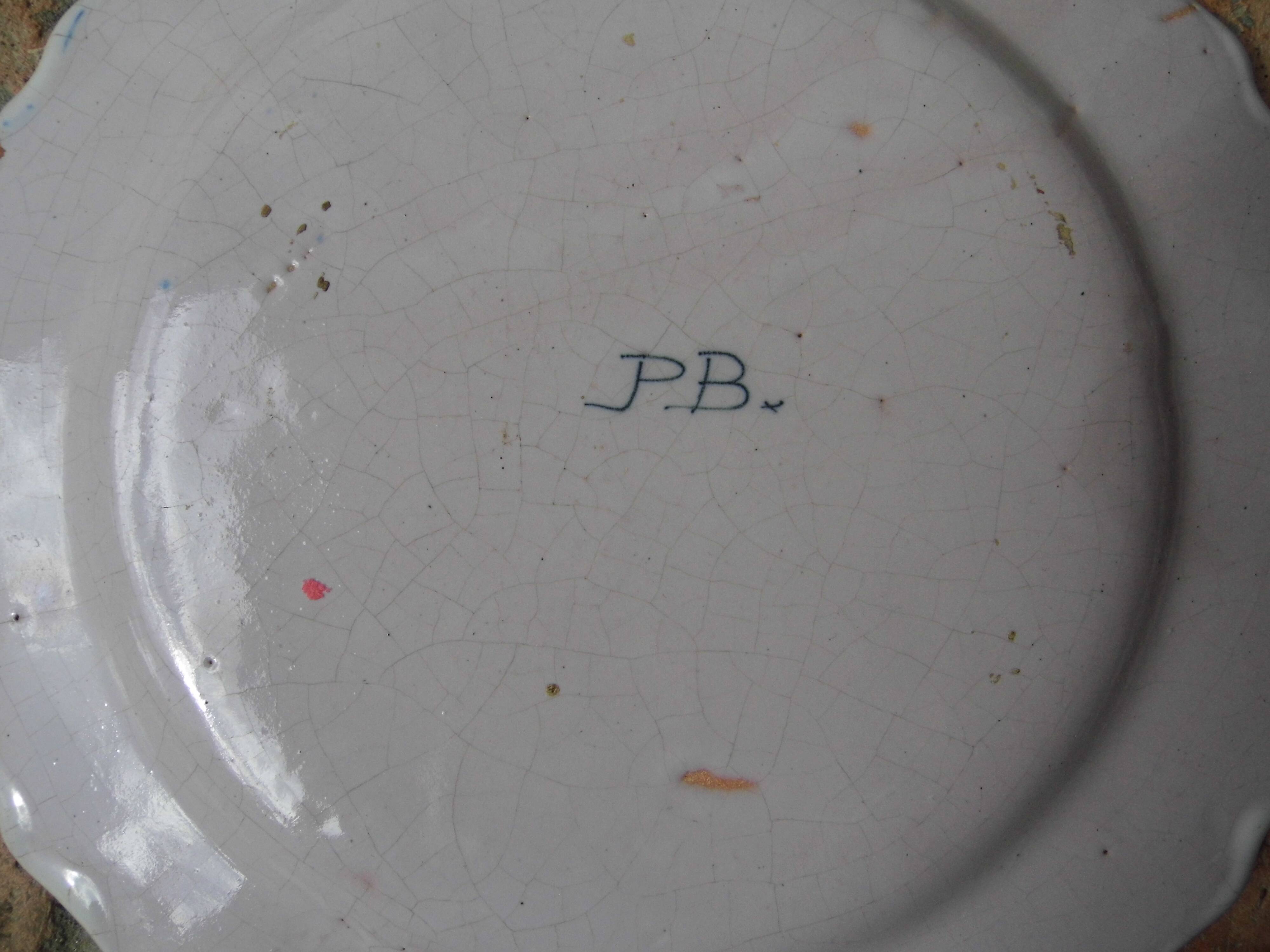 Malicorne earthenware plates, late nineteenth century, Breton décor.