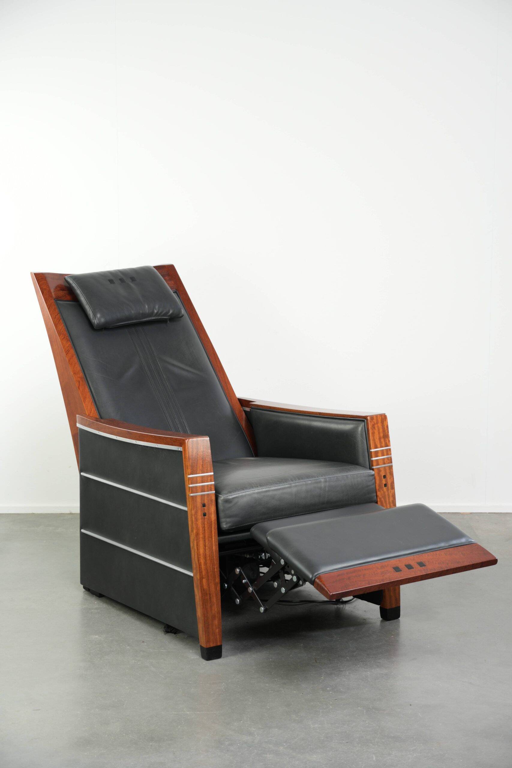 Electrically adjustable Art Deco design recliner with black cowhide leather