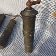Three oriental brass and iron pepper mills XIX century