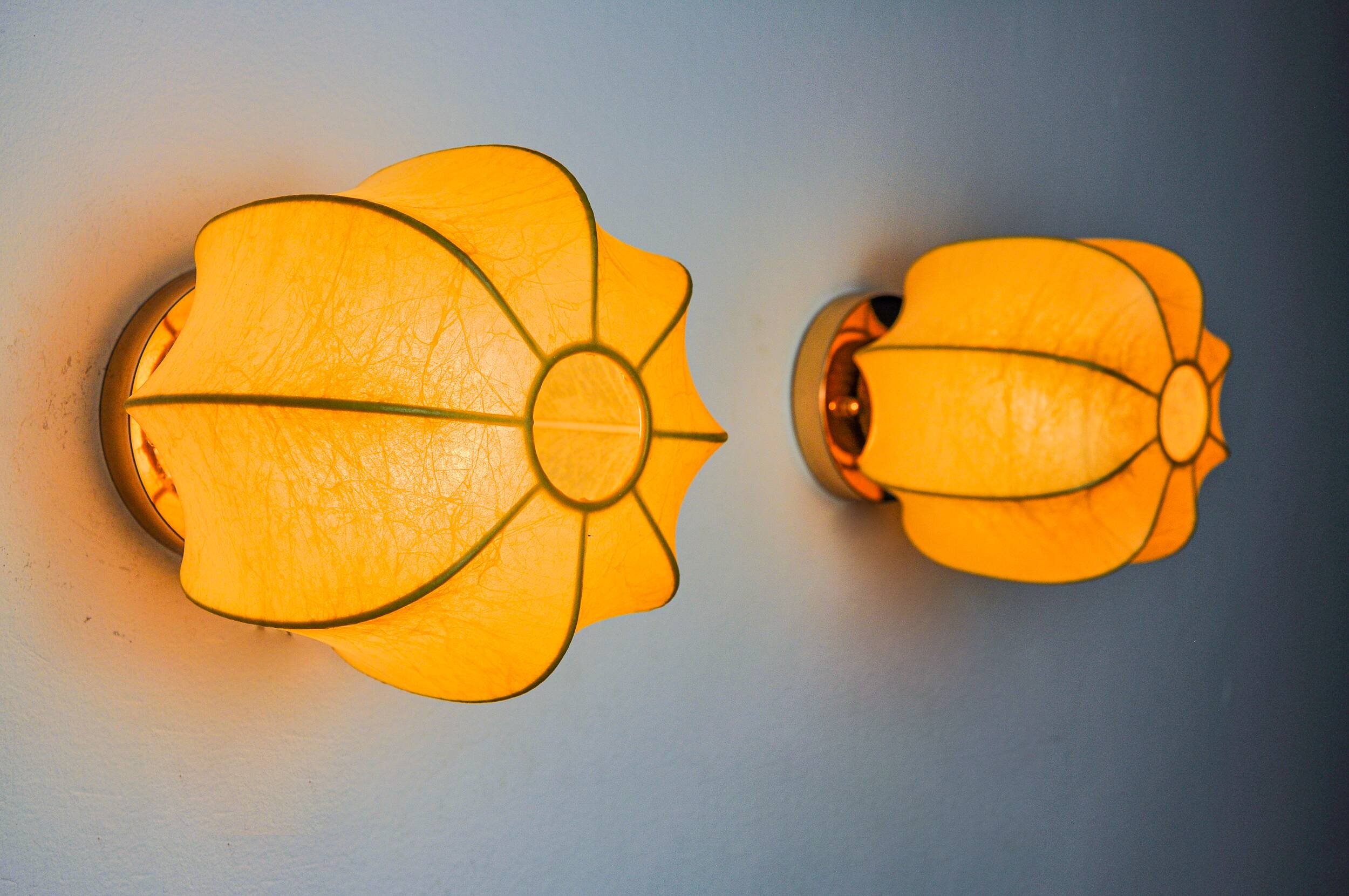 Pair of circular "cocoon" wall lights, resin and pine, Italy, 1970