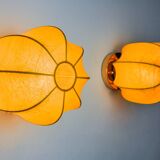 Pair of circular "cocoon" wall lights, resin and pine, Italy, 1970