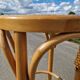High bar stool in curved wood and cane