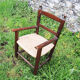 Old armchair for children wood & straw