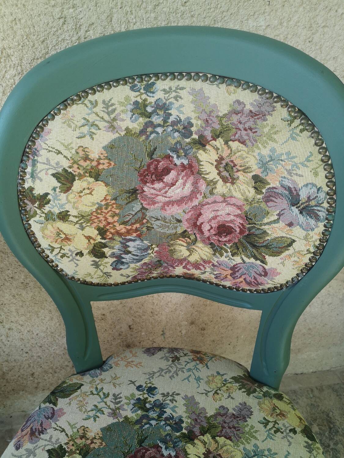 Antique chairs with studded upholstery.