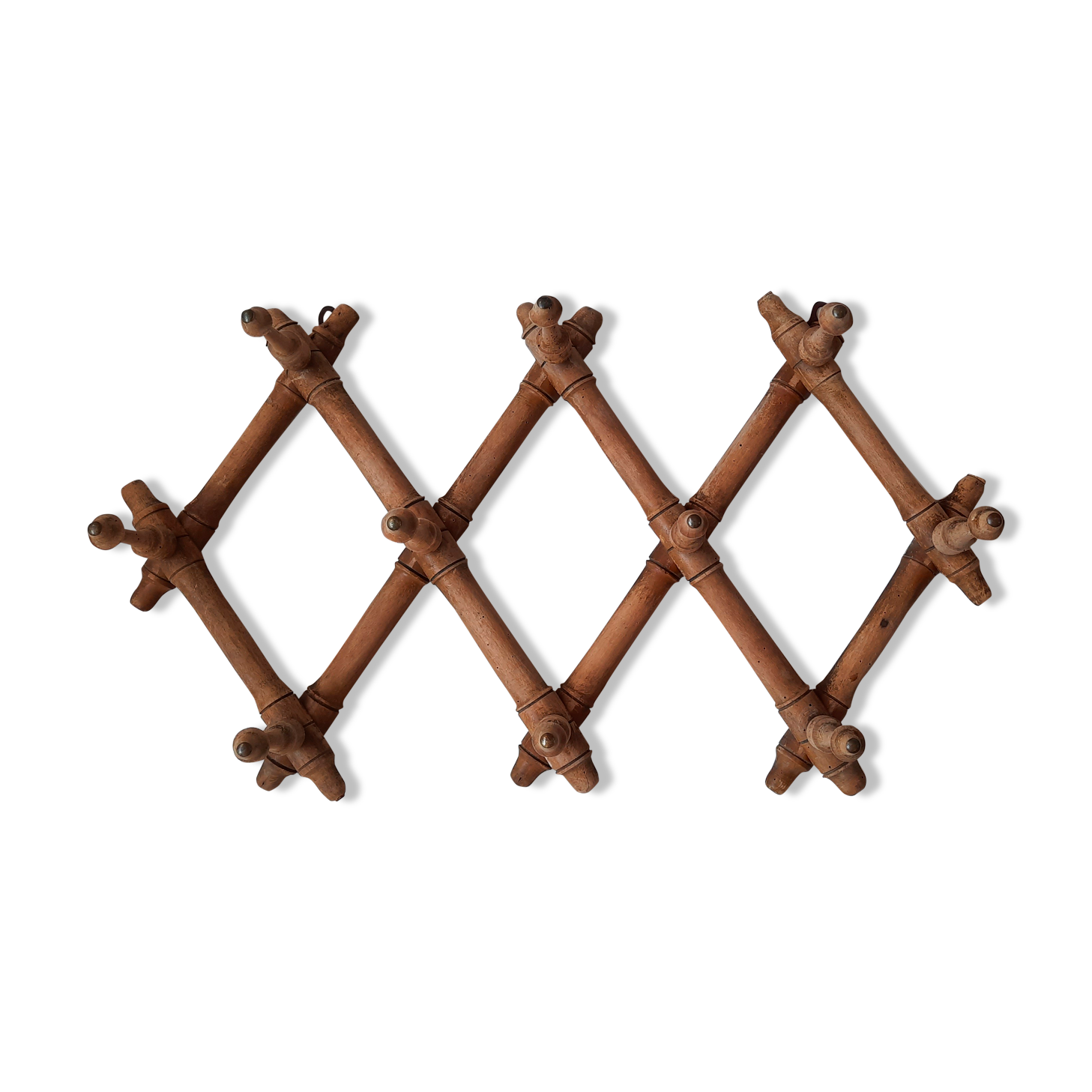 Old accordion wall coat rack