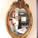 Miroir ovale en bois doré 98x63 cm