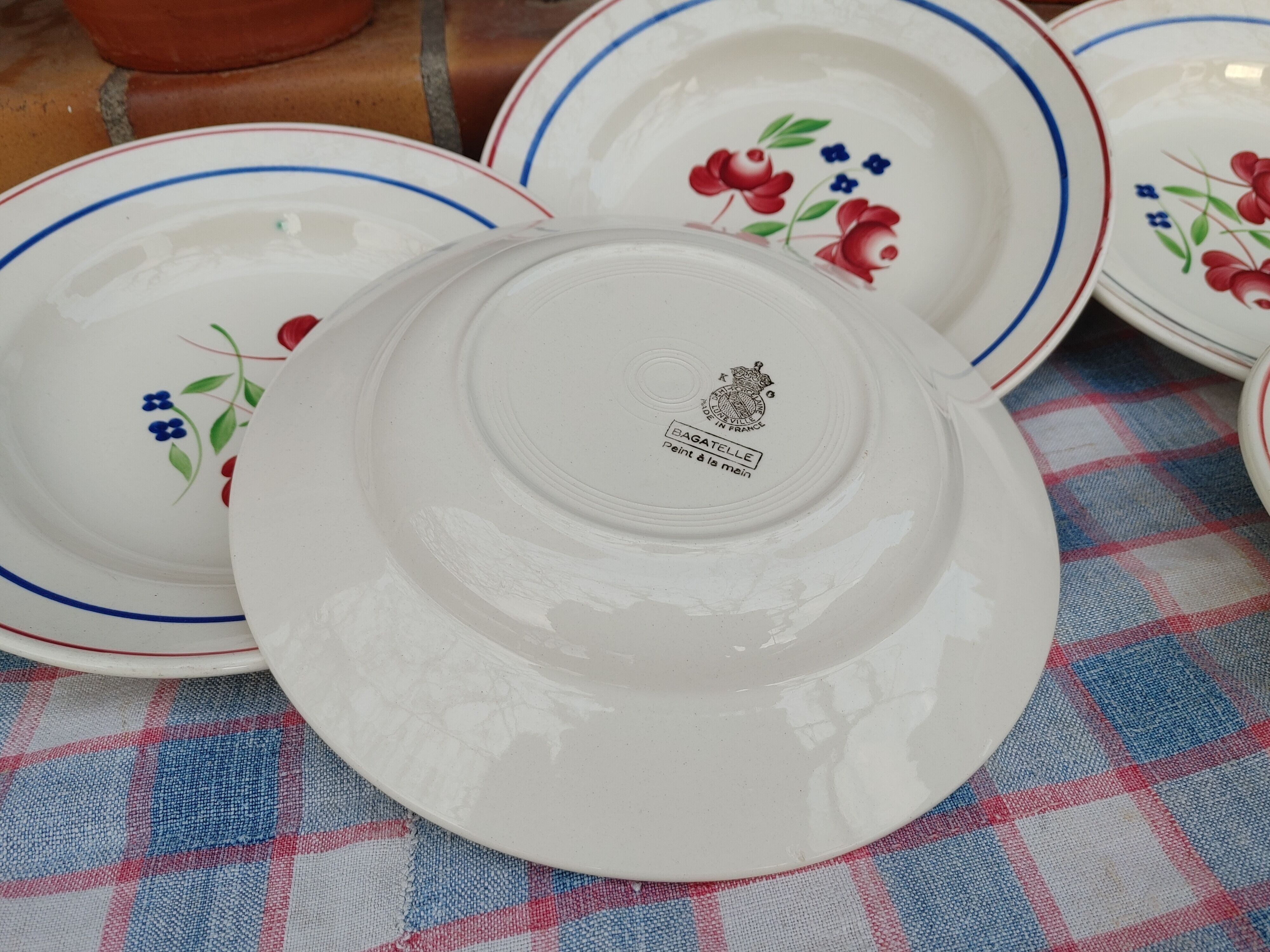 11 Deep Plates “Lunéville” Bagatelle model, Floral decoration Ø 23 cm