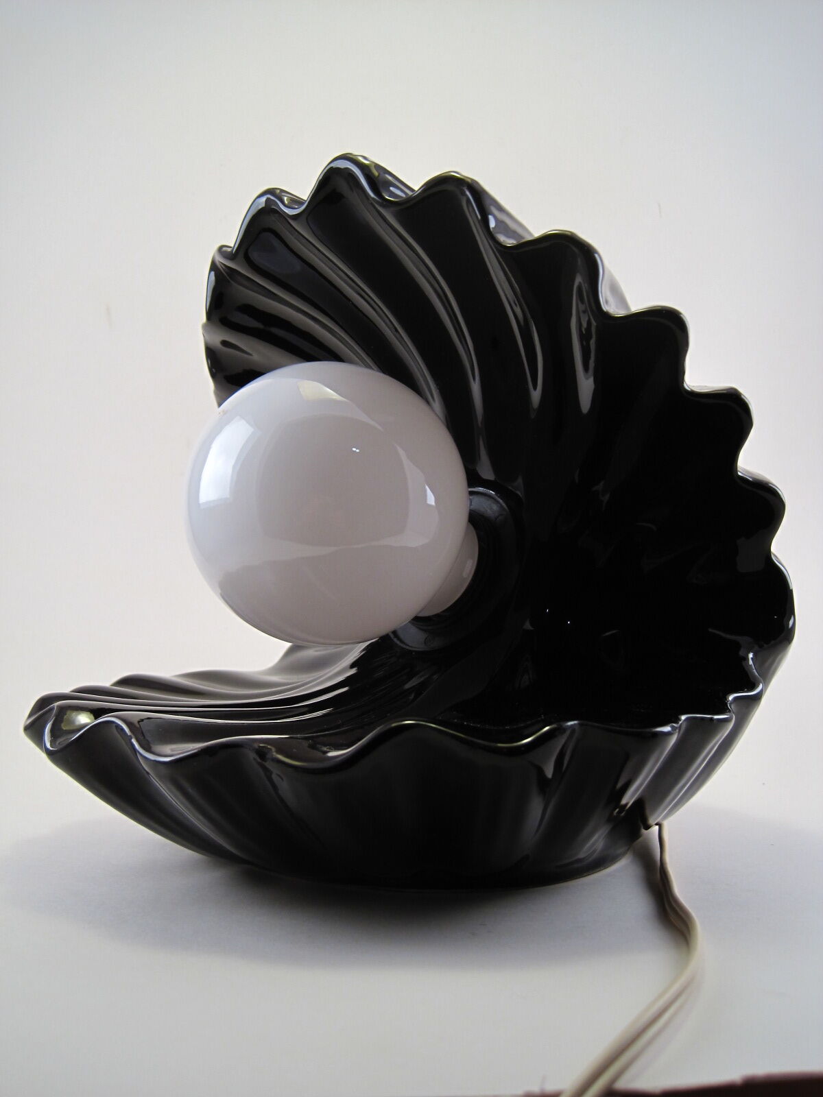 Vintage shell table lamp in black enamel ceramics design seventies 1970