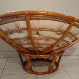 Rattan swivel chair and linen cushion