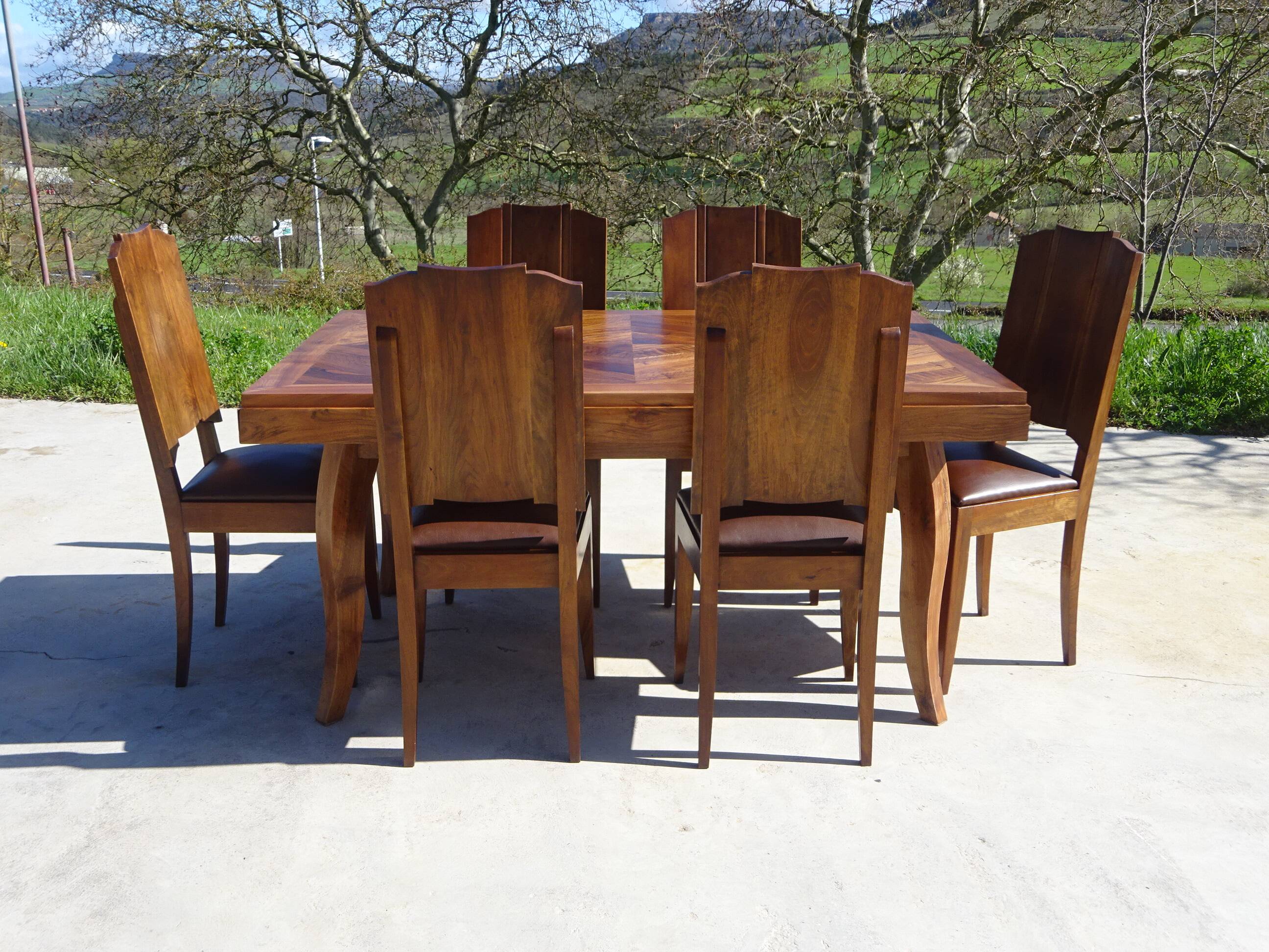 Antique solid walnut table with marquetry and extensions.